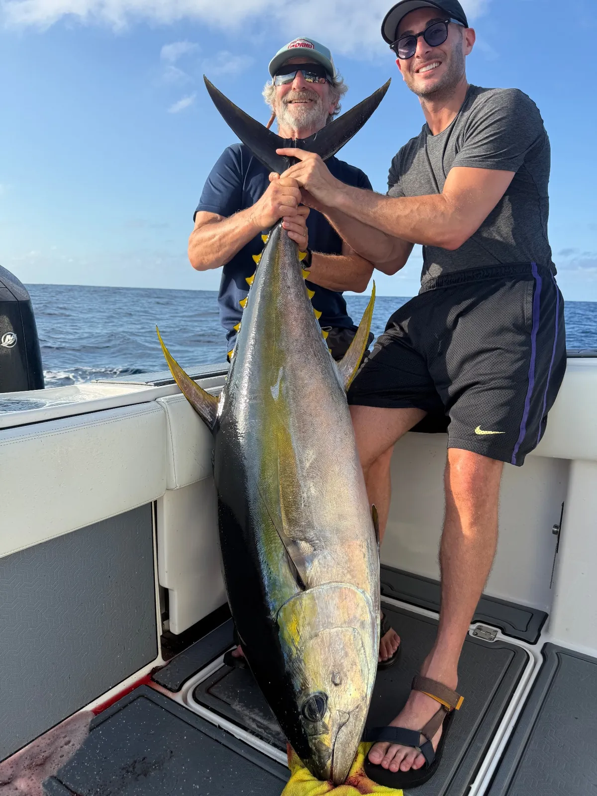 Anglers with a yellowfin tuna aboard a Playita charter