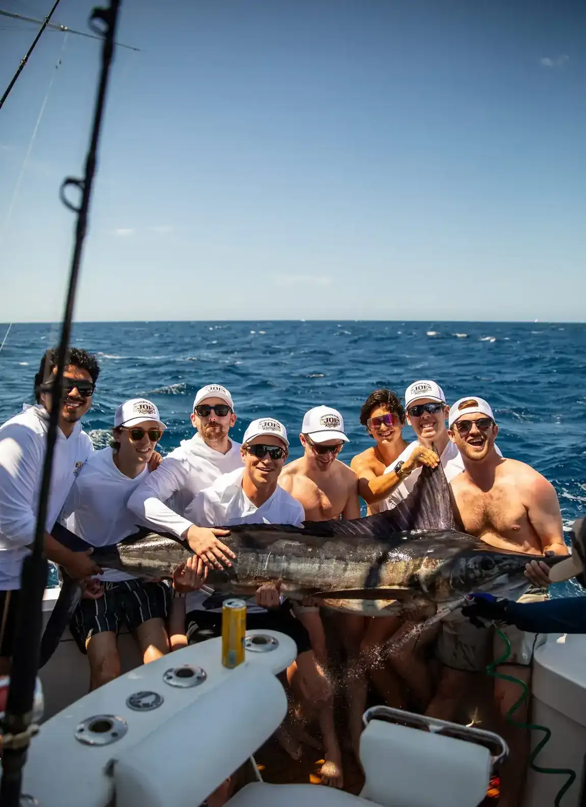 Group with a striped marlin aboard a Los Cabos charter