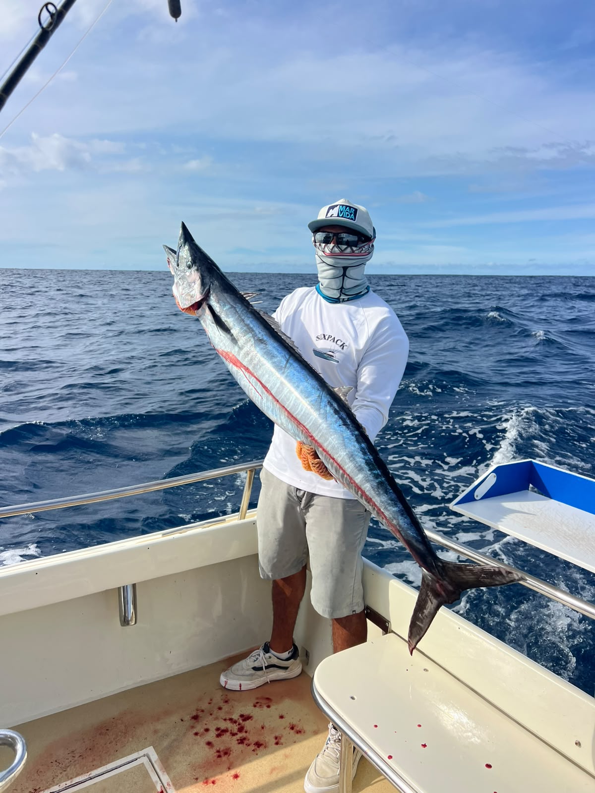 Angler holding a wahoo off Los Cabos