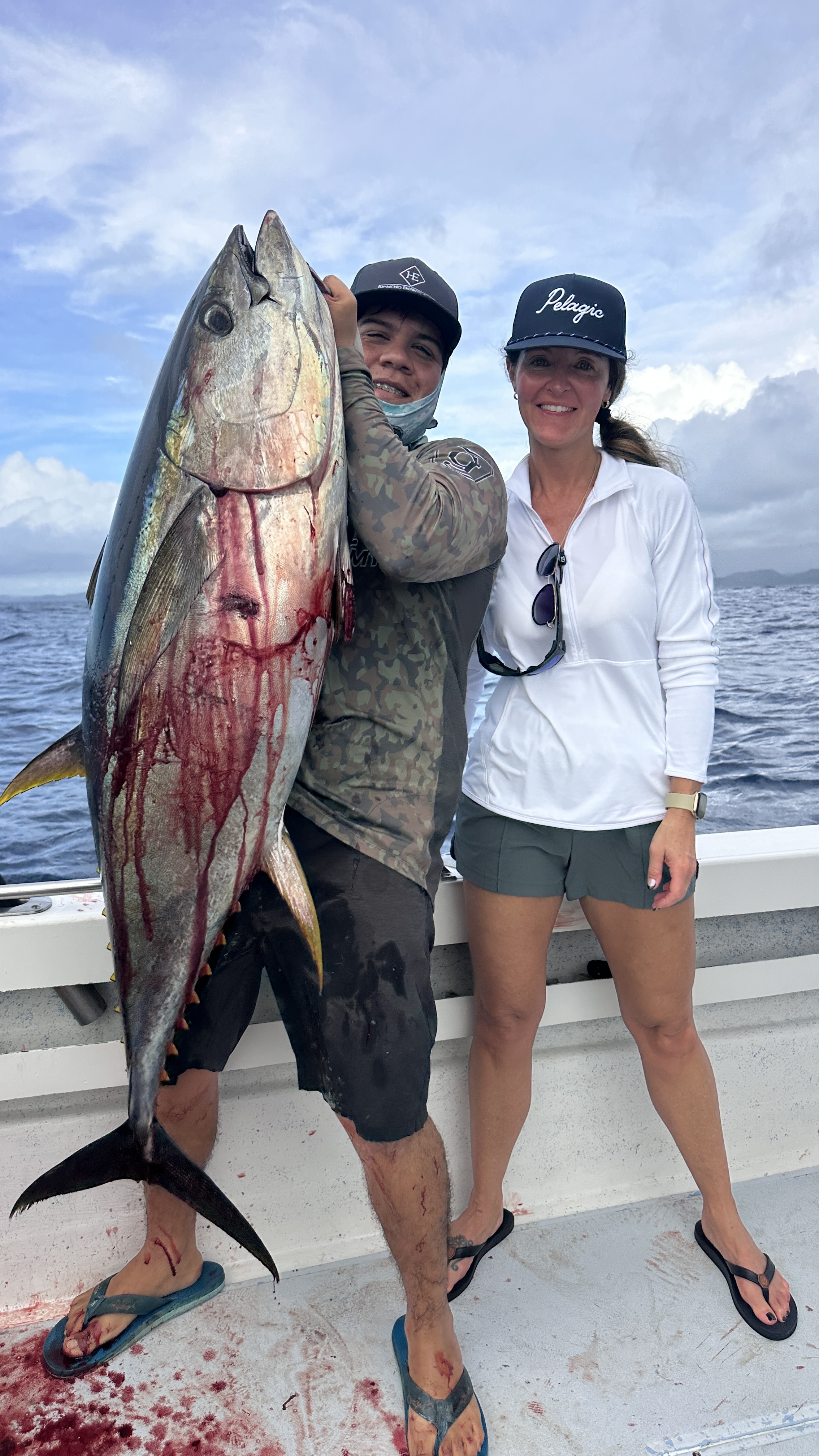 Anglers with a yellowfin tuna on the dock